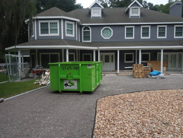 dumpsters on unpaved driveways